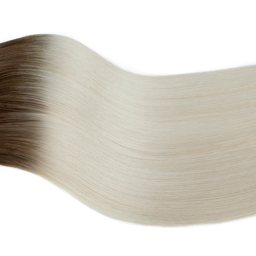 #4T60 Dark Brown Root to Platinum Blonde hair color swatch